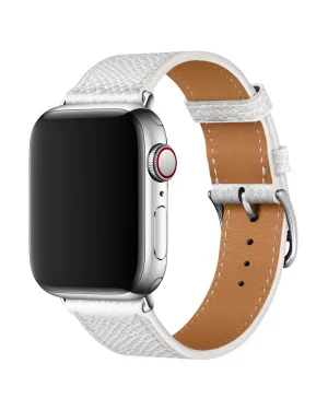 White leather Apple Watch band with tan leather interior and silver buckle