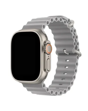 Silver titanium smartwatch with concrete gray ocean band and orange digital crown