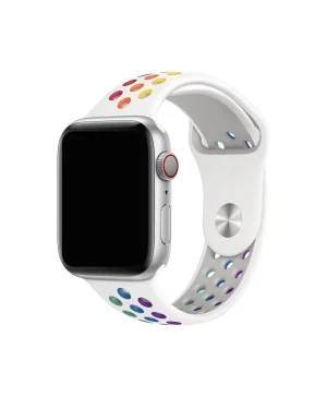 Apple Watch with white silicone sport band featuring colorful rainbow pride dot pattern